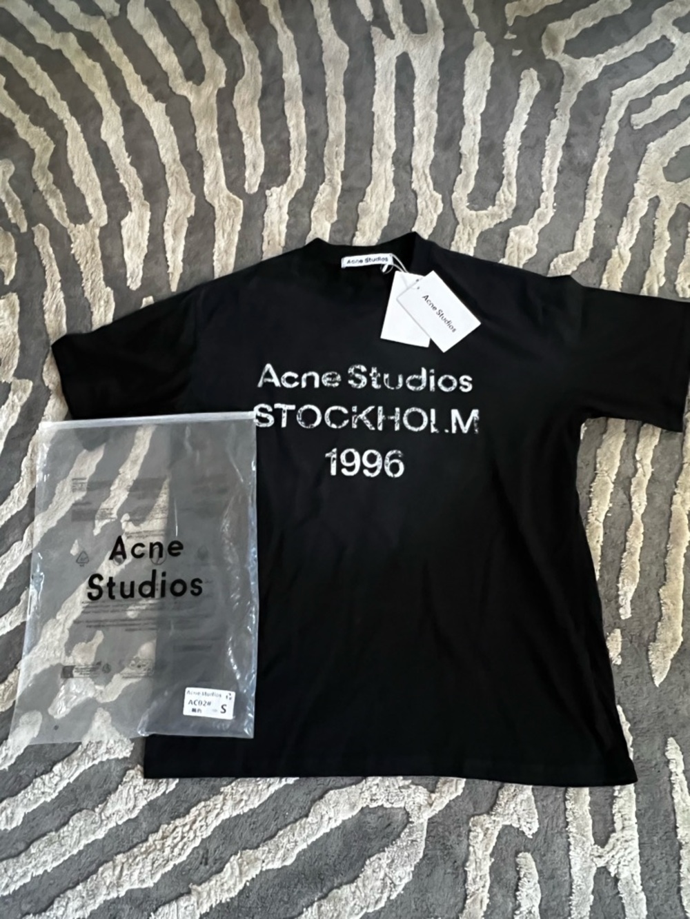 Acne Studios Black T-Shirt with White Graphic 'STOCKHOLM 1996' this is fake